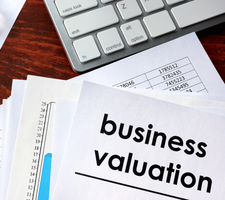 papers on a desk outlining business valuation